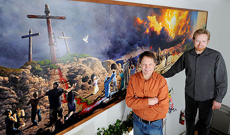 Dave Mattison, and Matt Philleo, members of Bethel Church, stand in front of new mural depicting the Gospel from Genesis to Revelation. Photo taken March 27, 2013 by Leader Telegram photographer, Dan Reiland