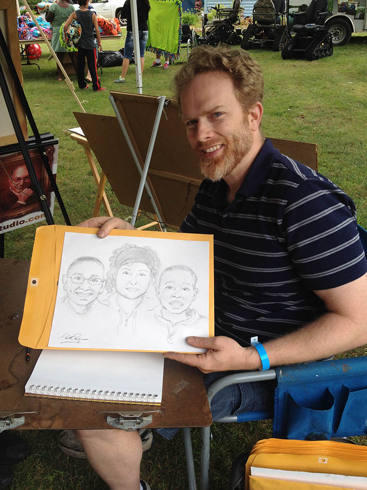 Pencil portrait artist Matt Philleo drawing live portraits at the United Special Sportsman Alliance Summerfest Event on Friday July 15, 2016 at Pittsville, WI