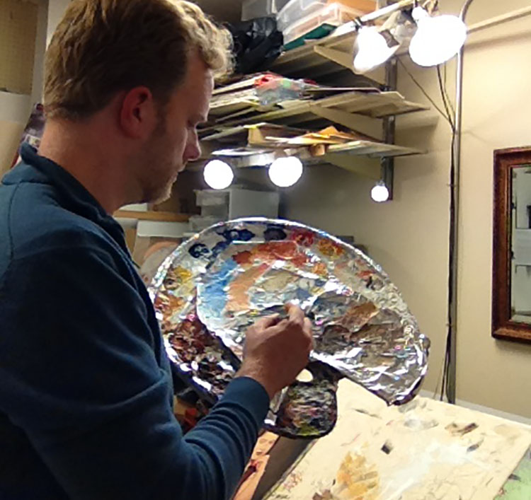 Portrait painter Matt Philleo mixing colors on his palette at Artisan Forge Studios on October 29, 2016